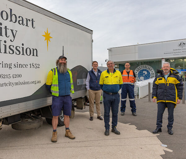 Group photo of Hobart City Mission and Australian Antarctic Division staff at head office