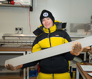 Dr Tessa Vance with an ice core in a storage laboratory.