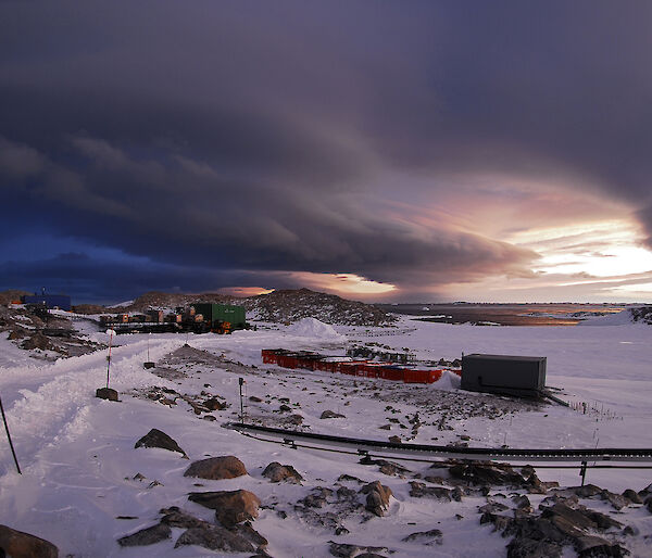 Antarctic station under dark clouds