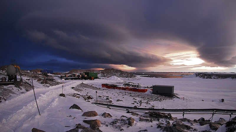 Antarctic station under dark clouds