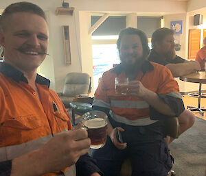 Two expeditioners drinking a beer at the bar