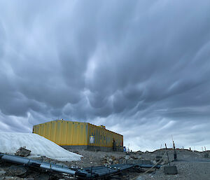 Mammatus clouds bubbling above the Operations building at Casey