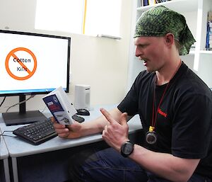 An expeditioner working at a computer