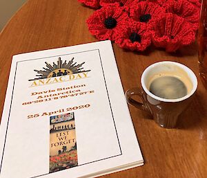 Knitted poppies, program and coffee.