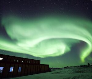 A green aurora australis lights up the sky above the workshop