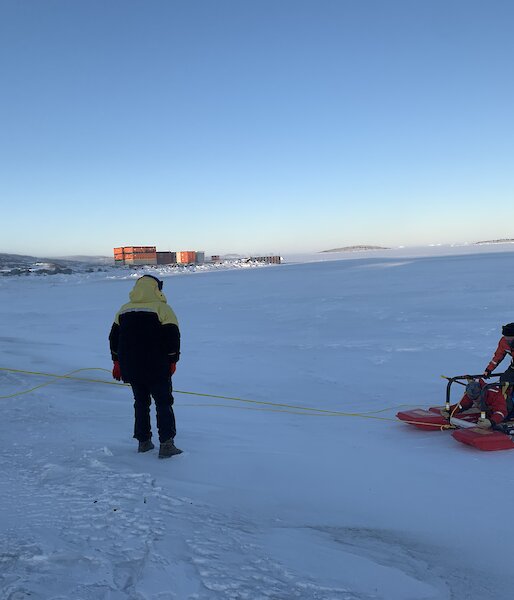 Three expeditioners undertaking a search and rescue exercise