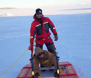 Two expeditioners on a rescue platform