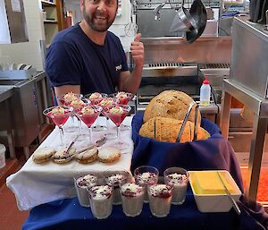 Chef behind platters of food