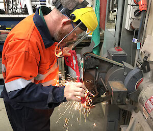 Man using angle grinder