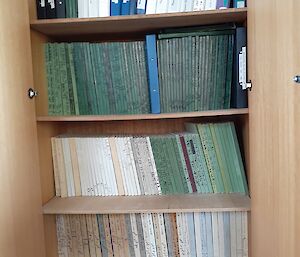 book shelf filled with log books