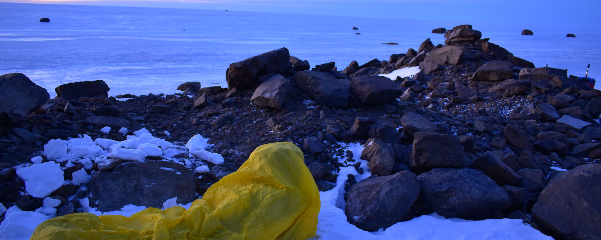 a single expeditioner in their bivvy bag