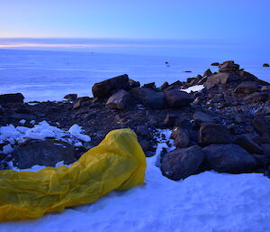 a single expeditioner in their bivvy bag