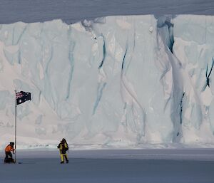 Erecting flagpole in the ice