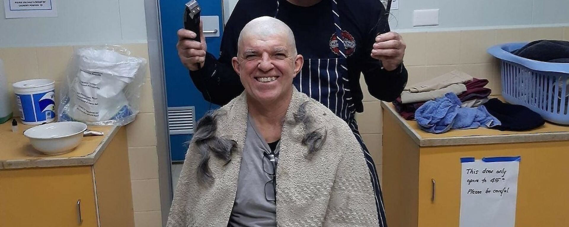 A man getting his head shaved