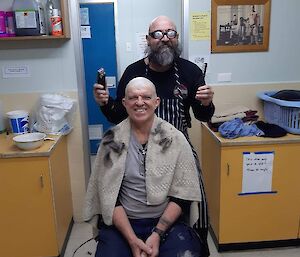 A man getting his head shaved