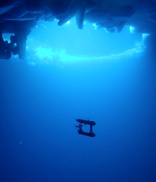 AUV underwater with ship visible above.