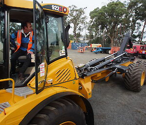 View from the front of a truck to its hydraulic hook mechanism behind.