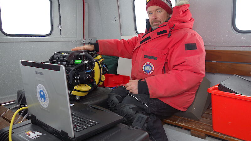 Dr Jonny Stark with the ROV and its control centre, in the back of a hägglunds.