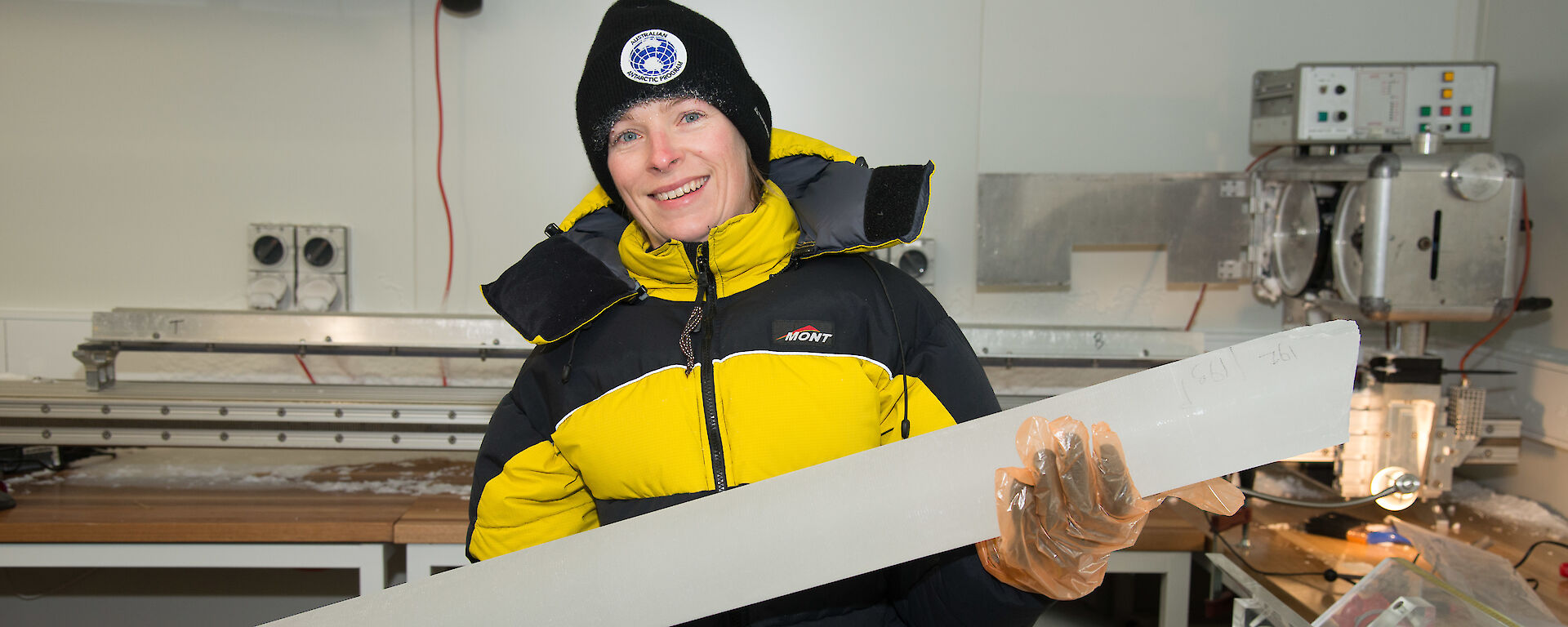 A scientist holds an ice core.