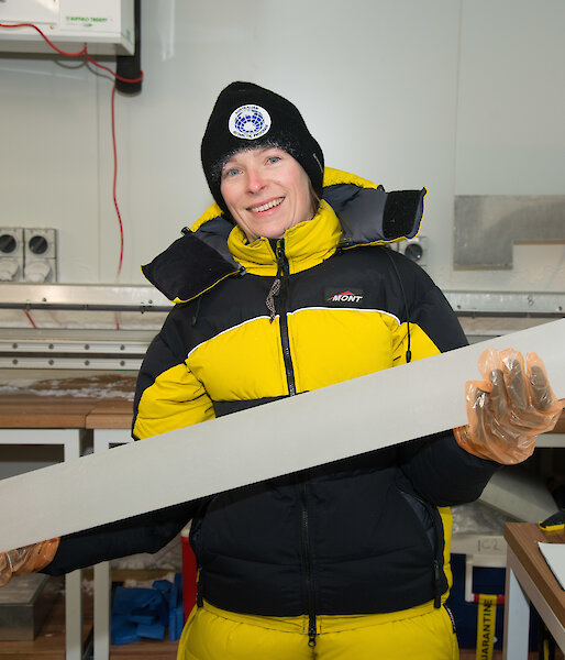A scientist holds an ice core.