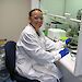 Dr Suter sitting at a laboratory bench with krill samples.