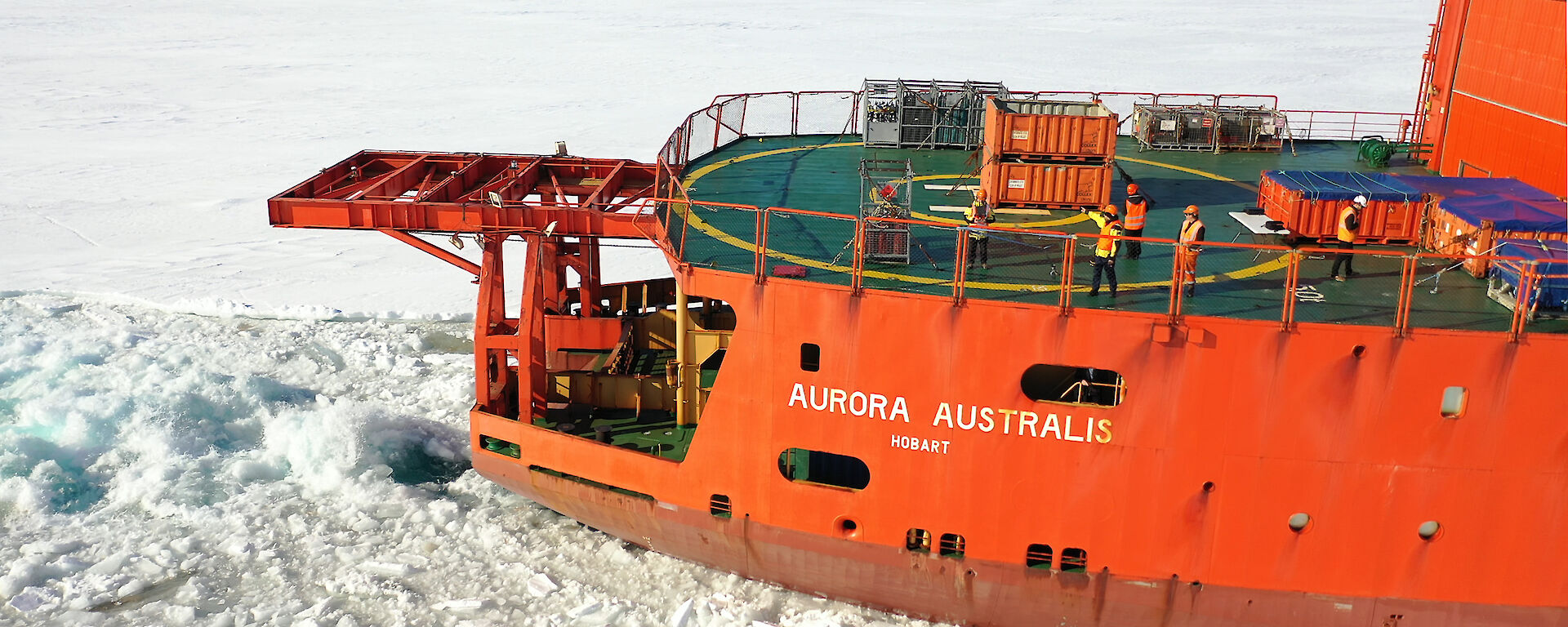 Drone photo of the back deck of the Aurora Australis in sea ice.