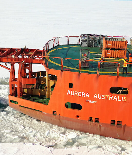 Drone photo of the back deck of the Aurora Australis in sea ice.