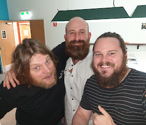 Three expeditioners showing off their beards