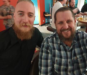 Two expeditioners smiling with their beards