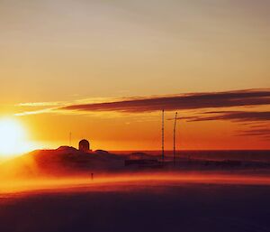 A sunset captured at Wilkes turning everything around orange/red