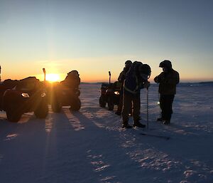 Four expeditioners at one of the sea ice drilling localities