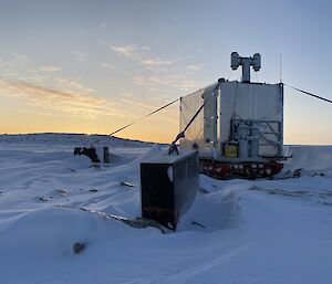 A field hut covered in snow