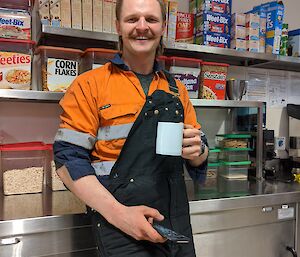 The diesel mechanic having a coffee in the mess