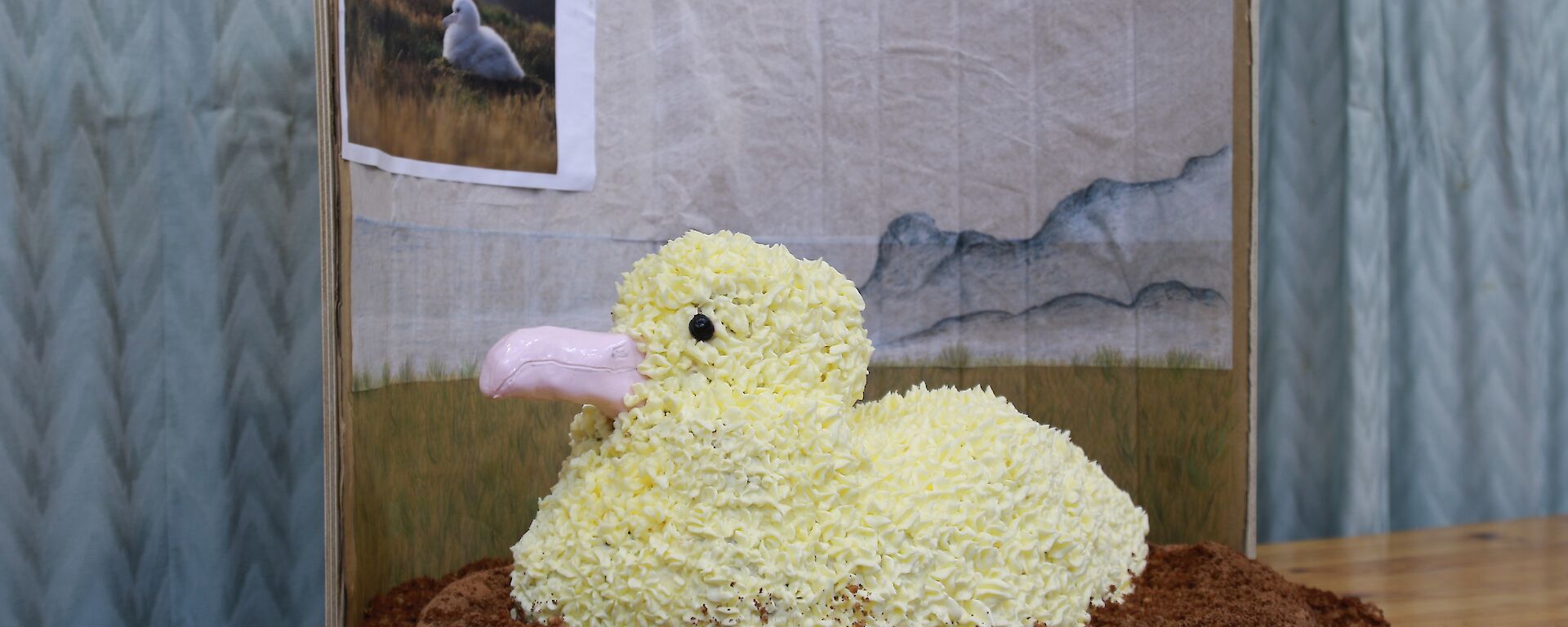 a cake made to resemble an albatross on a nest