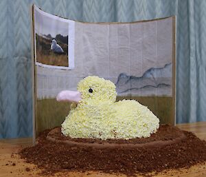 a cake made to resemble an albatross on a nest