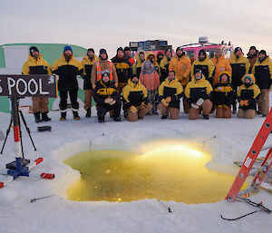 Australia’s expeditioners at Davis research station celebrating midwinter with a subzero swim through a hole cut in the sea ice
