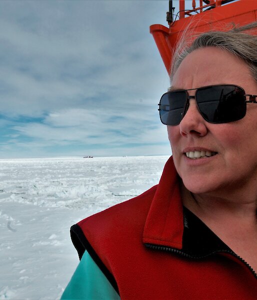 woman on bridge of icebreaker surrounded by sea ice