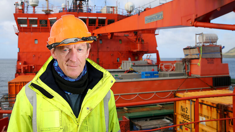 A man on the bow of a ship