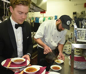 Chef and server in the kitchen