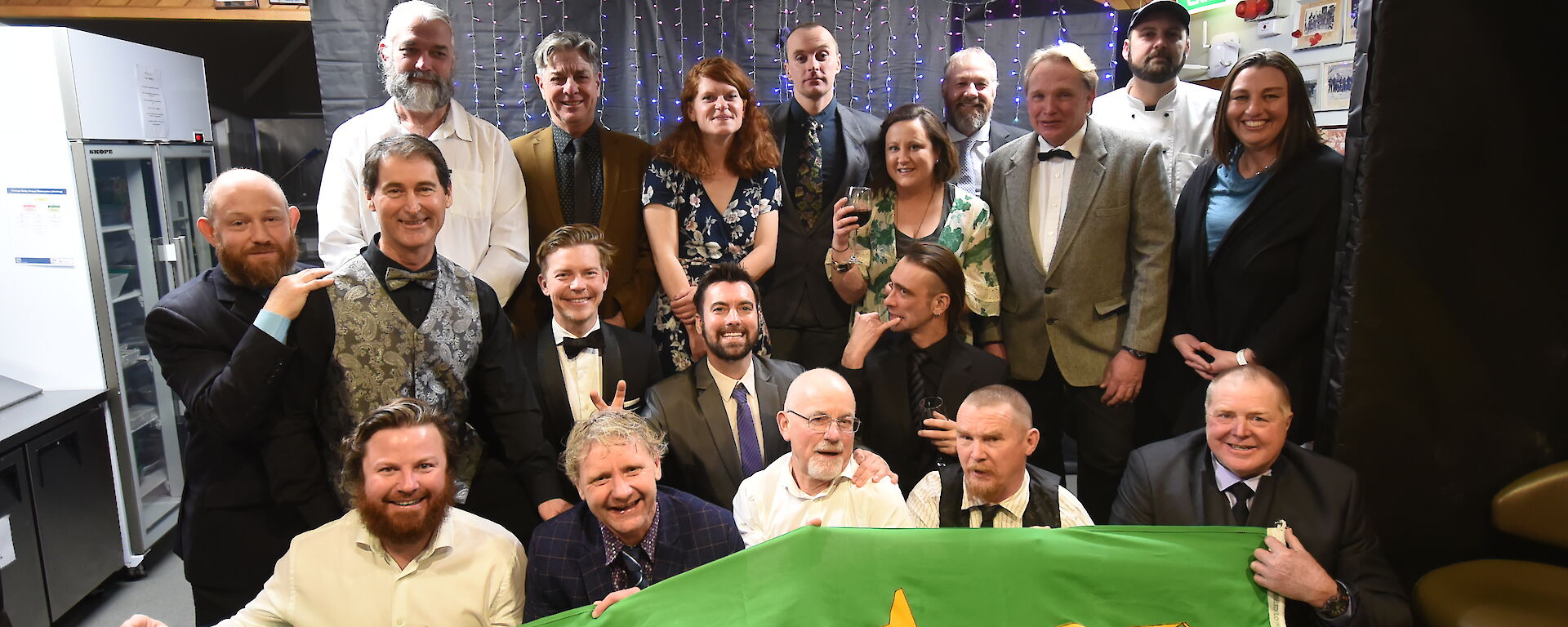 Group photo of expeditioners wearing formal clothes