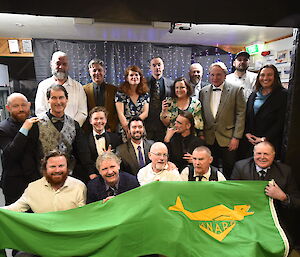 Group photo of expeditioners wearing formal clothes