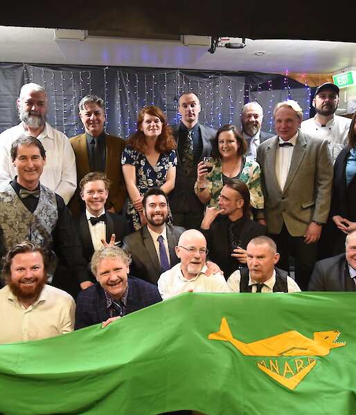 Group photo of expeditioners wearing formal clothes