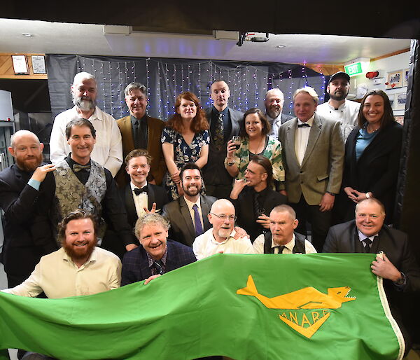 Group photo of expeditioners wearing formal clothes