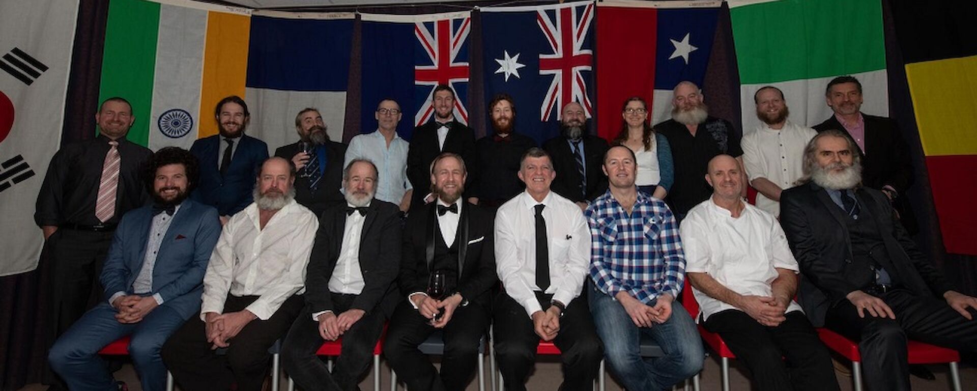 Group photo of expeditioners wearing formal clothes