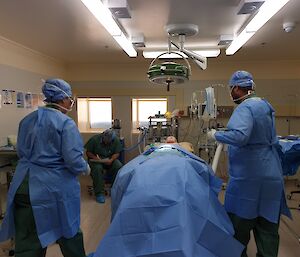 Doctor and assistants in theatre for a surgical scenario