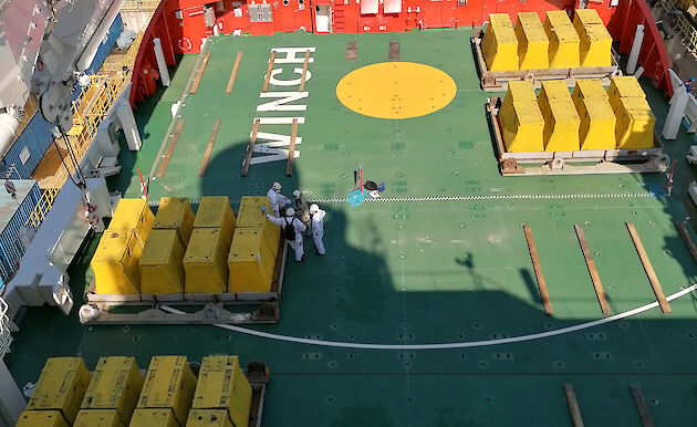 Four groups of weights arranged on the deck of the ship.