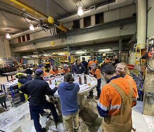 A spit roast and social gathering in the mechanical workshop at Casey