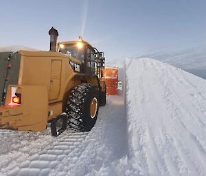 A loader pushing snow at Casey