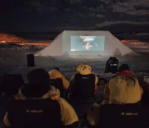 A crowd watching an outdoor movie at  Casey recently