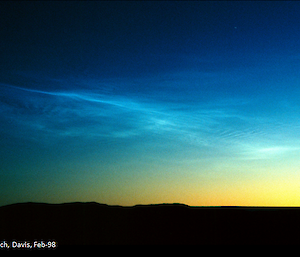 Shimmering blue noctilucent cloud high above Davis research station in Antarctica.